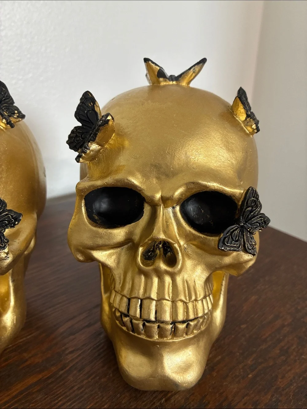 NWT- Set of 2- STUNNING- Gold Skull Statues with Black Butterflies Accents